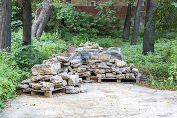 Large gray stones for landscape design on a wooden pallet