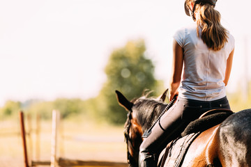 Picture of young pretty girl riding horse - Powered by Adobe