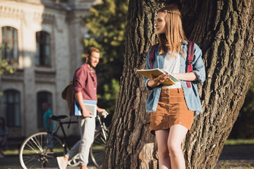 student girl reading homework