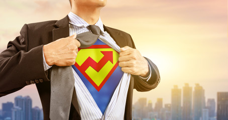 businessman in superhero costume with rising graph © Warakorn