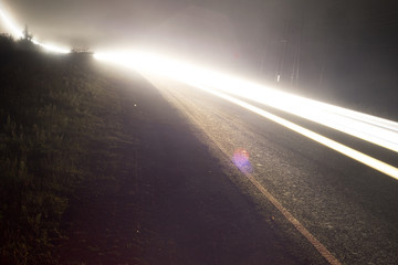 The headlights of the car are on long exposure.nd