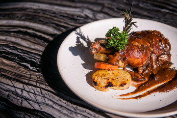 Roasted chicken leg with gravy and potato