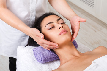 Fototapeta na wymiar Woman beautician doctor make neck massage in spa wellness center