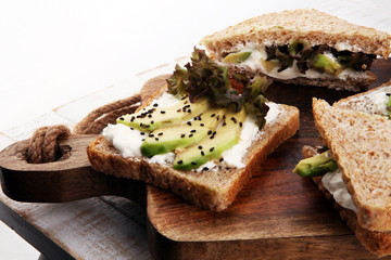 Sandwich with avocado and sesame - healthy breakfast concept
