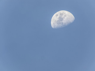 Half moon waxing gibbous in the dusk sky over Thailand