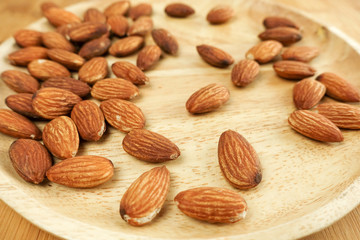 almonds in a wooden plate