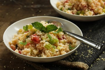 Tabbouleh Salad - Popular vegetarian Mediterranean dish made of fresh cucumber,tomatoes,parsley and coucous