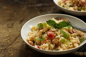 Tabbouleh Salad - Popular vegetarian Mediterranean dish made of fresh cucumber,tomatoes,parsley and coucous