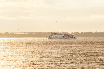 Obraz premium A walk on a river boat on the Volga at sunset