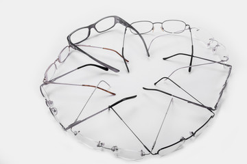 Plastic and metal frames for dioptrical glasses in circle