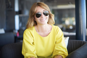 Beautiful smiling woman portrait. Close-up portrait of an attractive middle aged woman relaxing in...