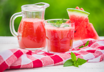 Fototapeta na wymiar Fresh watermelon juice outdoors in summer