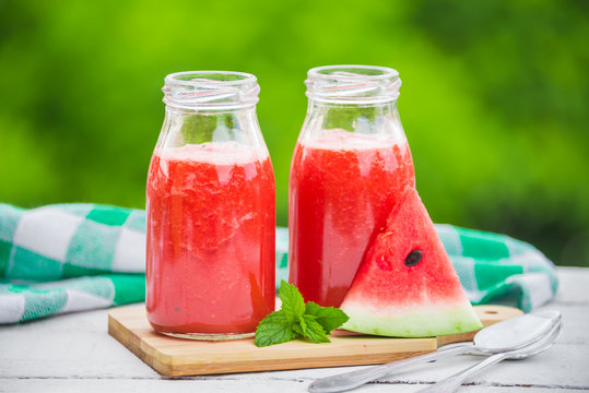 Fresh watermelon juice in bottles outdoors