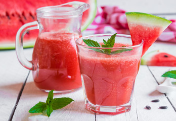 Fresh watermelon juice on wooden table
