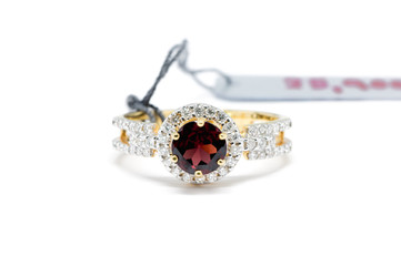 Closed up Red Diamond with white diamond and gold ring