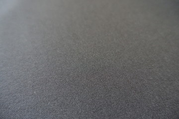 Close up of plain dark grey fabric