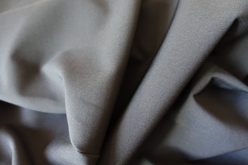 Folded plain black fabric without prints or patterns