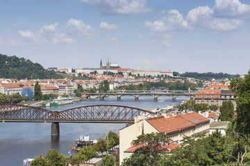 Fototapeta na wymiar Prague city landscape. View from Visegrad. Bridges of Prague in sunny day. 