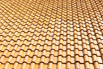 The glazed ceramic roof tile background.The texture of shiny roof tile .