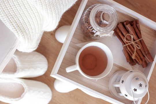 Cozy autumn. Home cosiness. Knitted plaid, hot tea, biscuits. Warm winter.