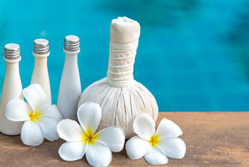 Thai Spa massage compress balls, herbal ball and treatment  spa, relax and healthy care with frangipani white flower, Thailand.  Healthy Concept.