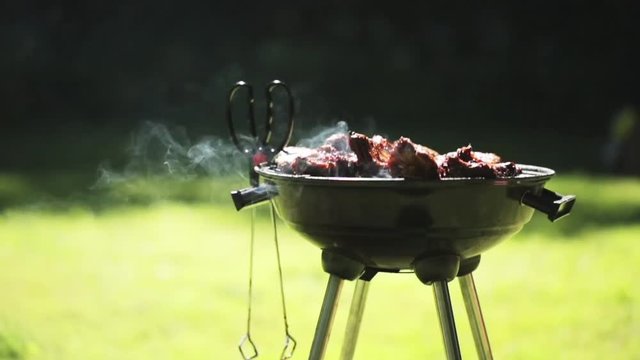 barbecue meat on grill or brazier outdoors