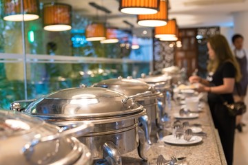 people catering buffet food indoor in luxury restaurant with meat colorful fruits and vegetables