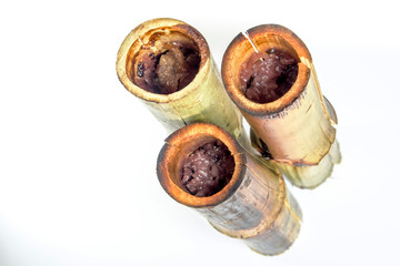 Glutinous rice and coconut milk roasted in bamboo joints