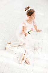 The little balerina in white tutu in class at the ballet school © master1305