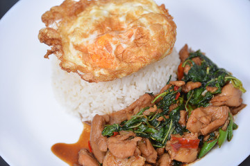 Rice with stir-fried pork and basil served with fried egg