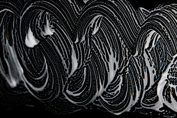 White soap texture. Glamorous white foam on black background. Handmade hipster foam texture. Abstract artistic soap background.