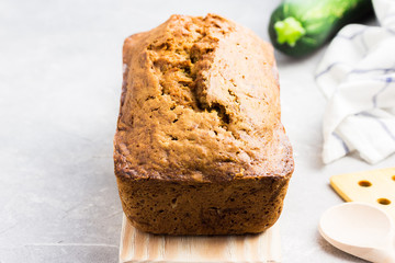 Zucchini banana loaf cake  on concrete background. Selective focus, space for text.
