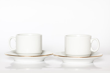 Two white tea cups and saucers mock up