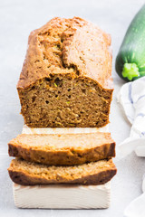 Lemon zucchini loaf cake on concrete background.  Selective focus, space for text.