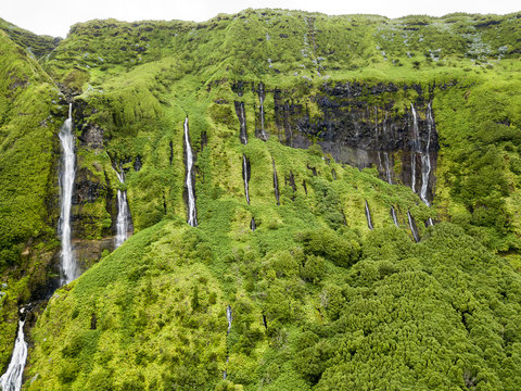 Aerial closeup view of the multitudes of waterfalls at Poca da Alagoinha near the small village of Fajazinha in Flores, a small island belonging to Portugal.