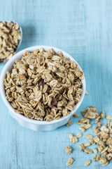 Almond Breakfast Cereal Granola In White Bowl With Spoon