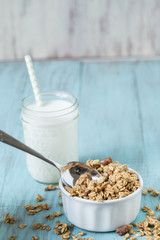 Almond Breakfast Cereal Granola With Glass of Milk And Spoon