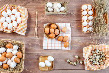Raw eggs on wooden table, top view