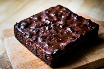 Chocolate Brownie on wooden surface.