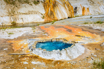 Blue boiling water in a crater. Hot spring, pool, water feature. Midway Basin. Yellowstone National Park