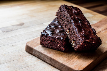 Chocolate Brownie on wooden surface.