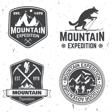 Vintage typography design with mountaineers and mountain silhouette.