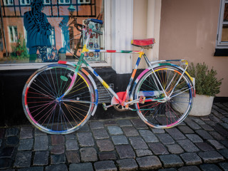 Fototapeta na wymiar Multi colored bike on a paved road