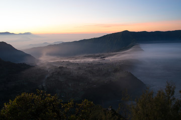 View of Cemara lawang village or Cemoro Lawang; small village in morning mist. Which situated on the edge of massive north-east of Mount Bromo, East Java, Indonesia
