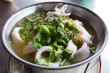 Steamed white octopus in lime soup background