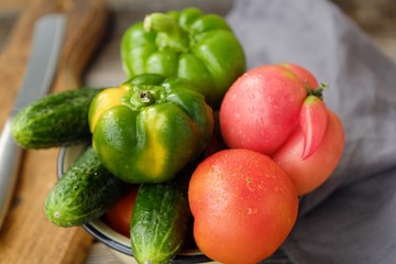 Fresh tasty vegetables on wooden background view