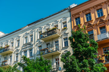 white, yellow and brown facaded buildings in a row