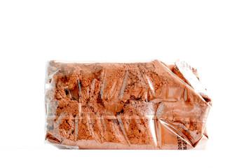 cocoa powder in plastic packaging with date of production isolated on white background