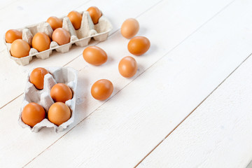 Fresh eggs on wood background. Copy space. Top view