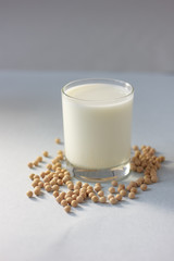 Soybean milk with soy beans around it